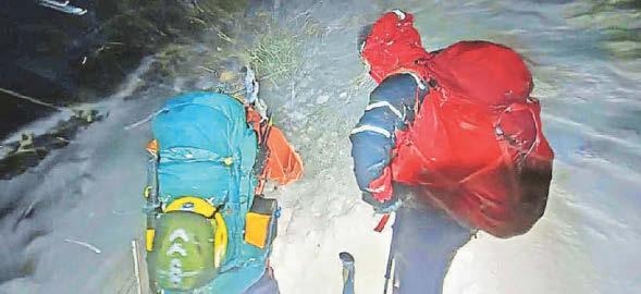Rescuers brave waist-high snow as multiple people caught out in mountains