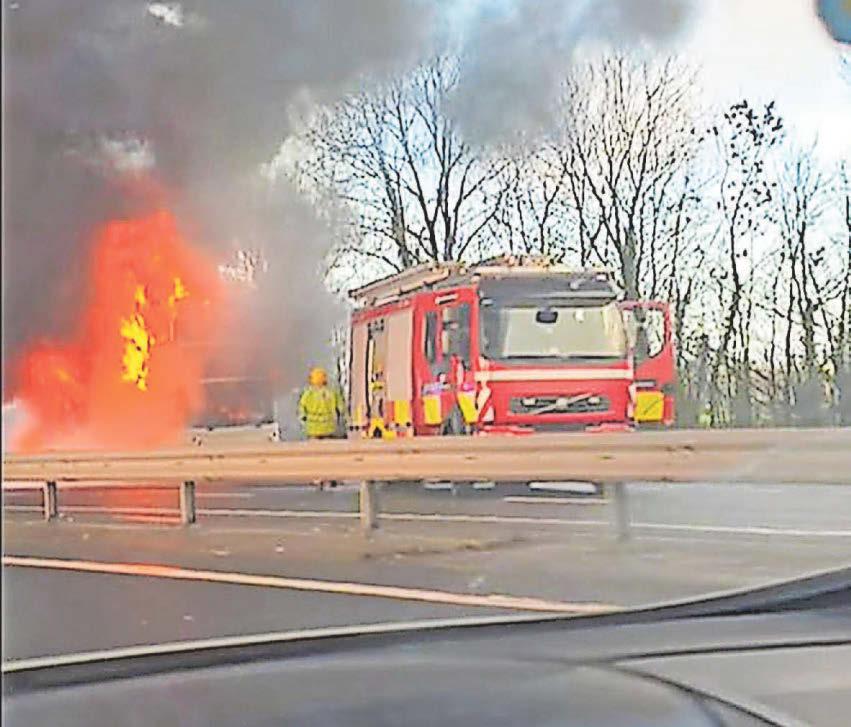 DRAMATIC MOMENT BUS BLAZES ON THE A55