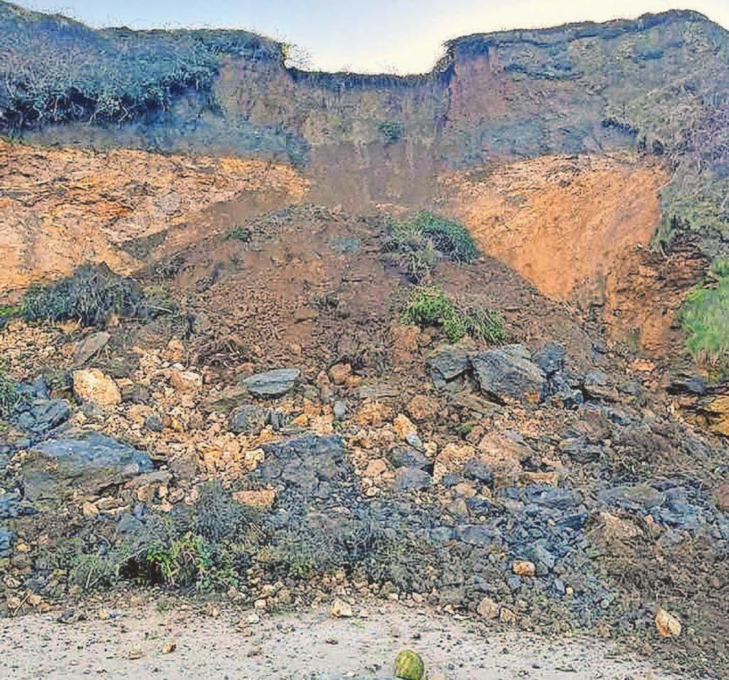 Terrifying moment as cliffs collapse on beach