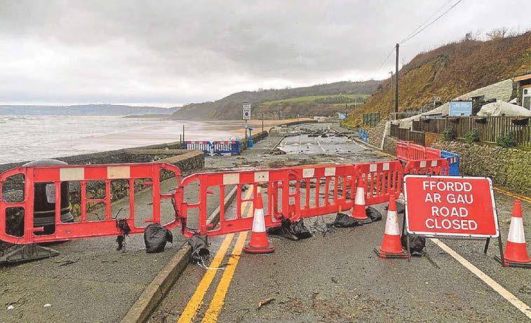 ROAD CLOSED FOR REPAIRS TO WAVE-BATTERED SEA WALL