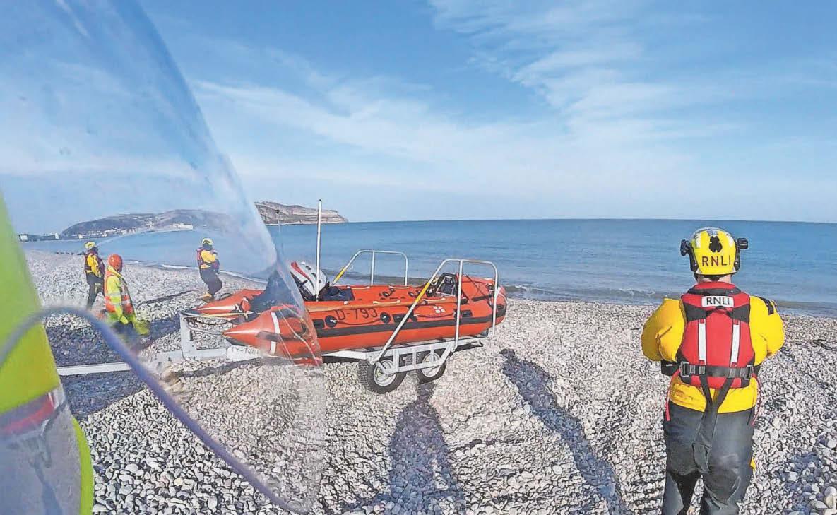 Alert after dog walker and pet stuck on rocks as tide came in