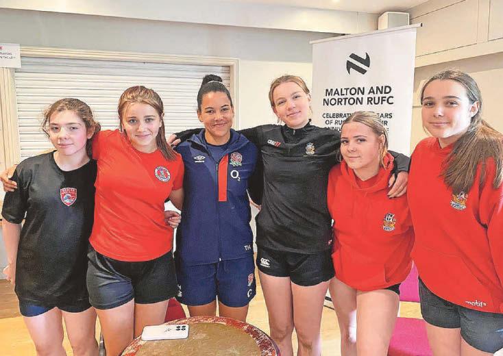Rugby starlet Erin urges other girls to 'give it a try'