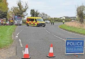 Road closed after van flips on to side