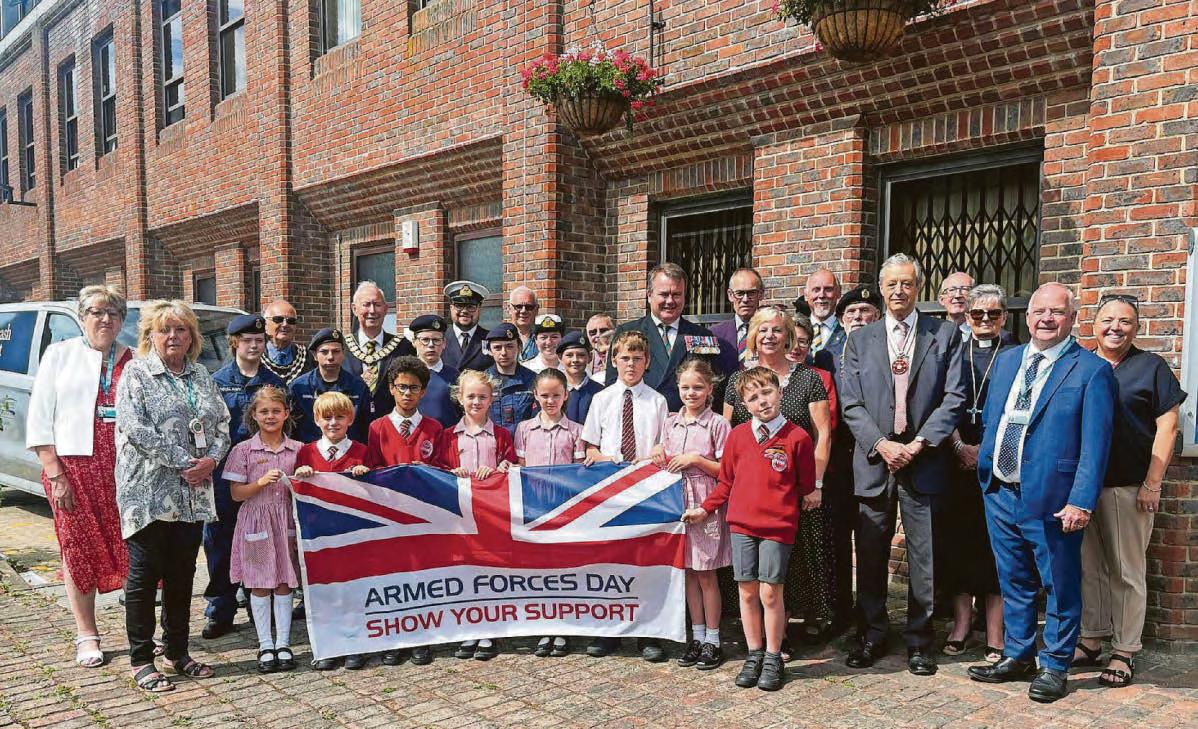 Local dignitaries see flag raised for Armed Forces Day