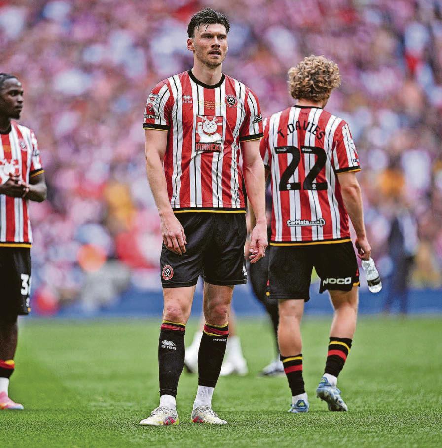 WATSON FIRES BLACK CATS TO PROMISED LAND