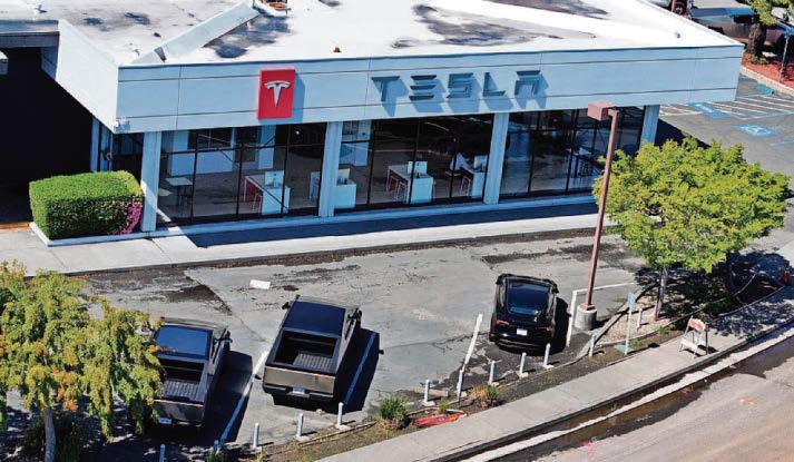 Musk takes political step down as Tesla earnings suffer slump