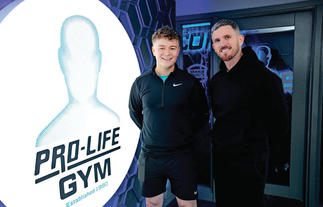 Running man Adam hands cash to charity
