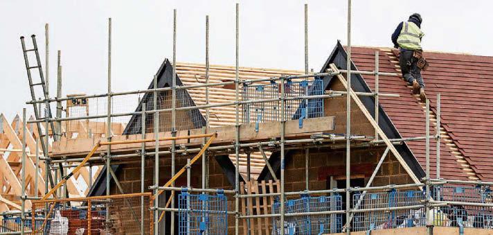 Taylor Wimpey shares fall as cost to fix cladding hits profits