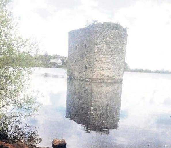 Castle ruins rise from the water