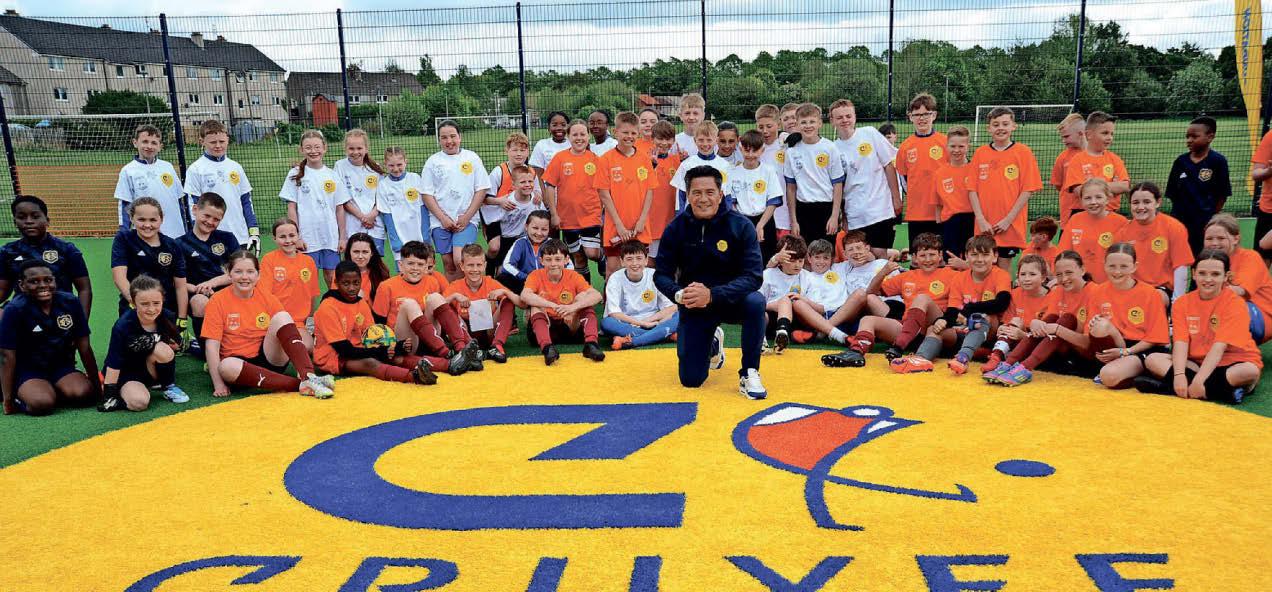 Football hero has a ball at new sports court