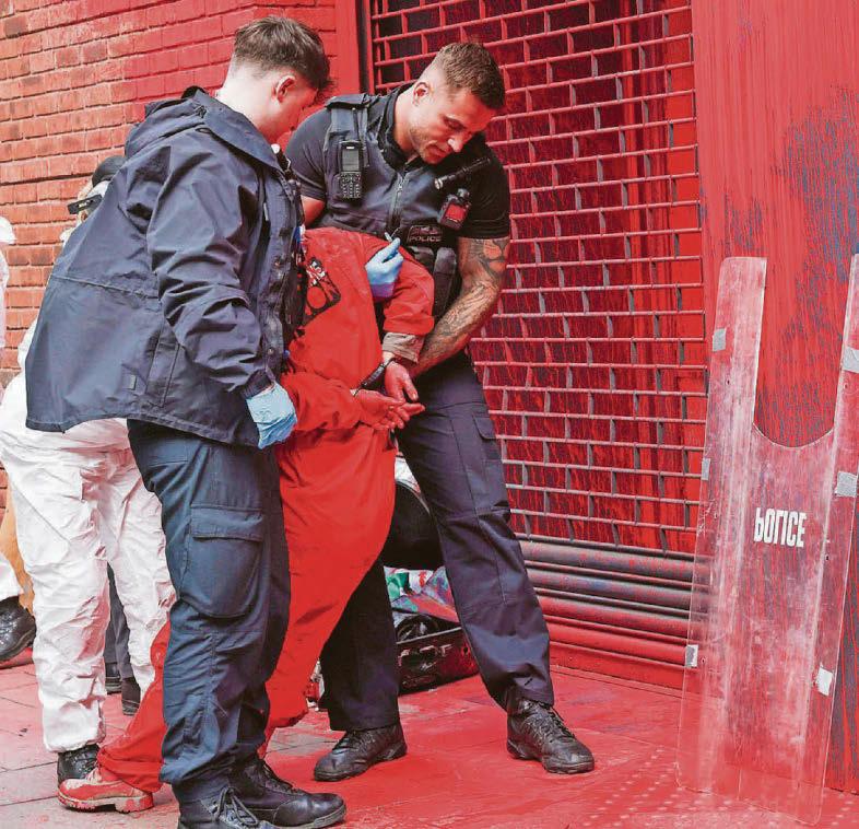 Three arrested after protesters target insurance firm
