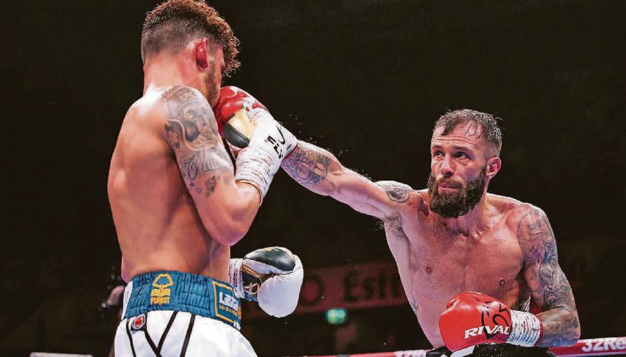 Boxing Cacace stops Wood in the ninth round to retain his title