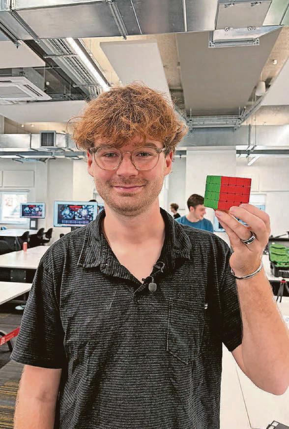 World record smashed Student's robot takes 33 seconds off Rubik's Cube record