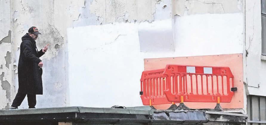 Cover-up Banksy confirms new work - but it's swiftly removed from view