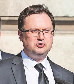 Minister defends plans for migrants in barracks
