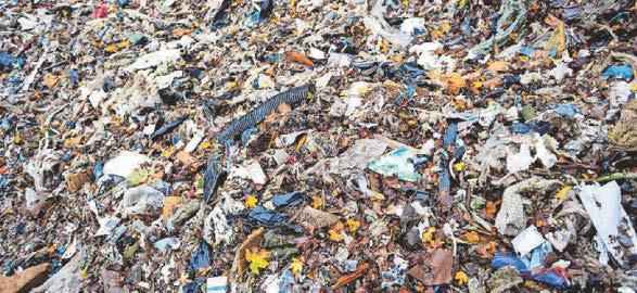 Fly-tipped mountain of rubbish threatens river