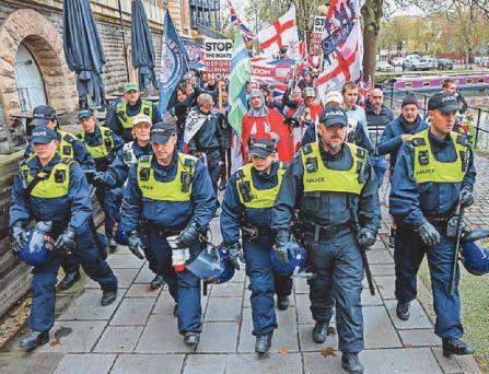 Five arrested and police officer injured in demos