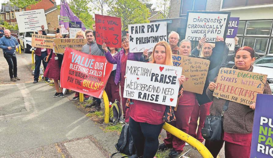 Rally marks 236th day of hospital worker strike