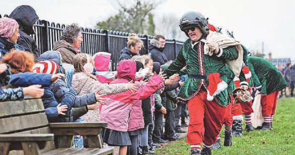 Santa and elves touch down for schools visit