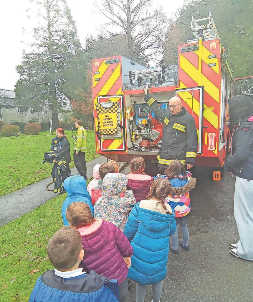 Children swap their pencils for fire hoses