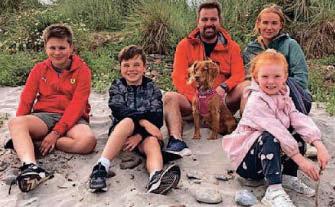 Hero father jumps in to help family caught by rip tide