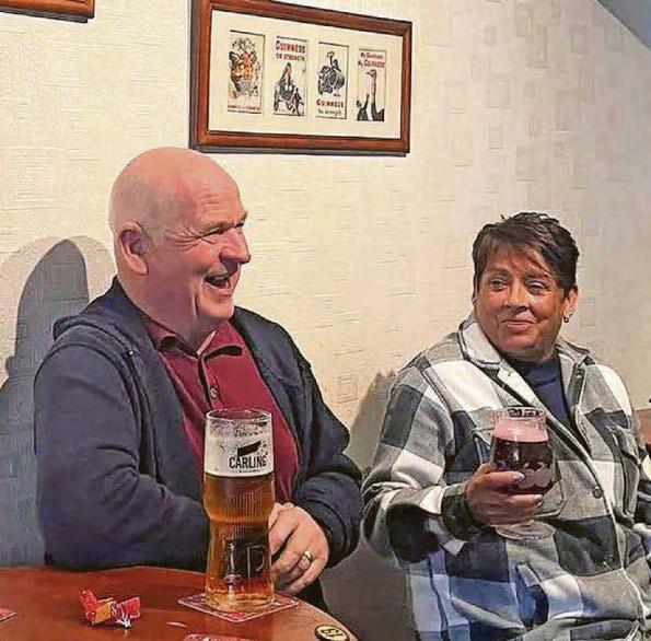 Landlords mark 20 years at helm of hostelry which is a 'cornerstone of the community'