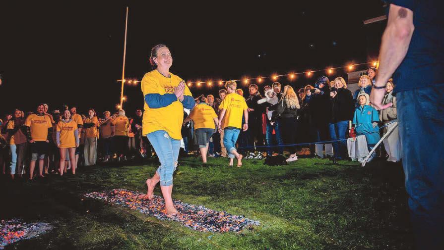 80 brave souls walk across burning embers to raise £20k for city charity