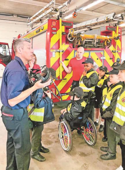 Mini Police pay visit to fire station