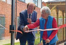 Founding resident cuts ribbon