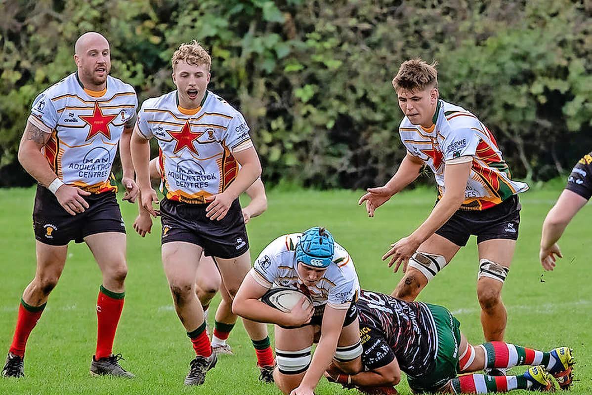 Leek hold their nerve to secure home win, while Sandbach stay at the summit with fresh victory