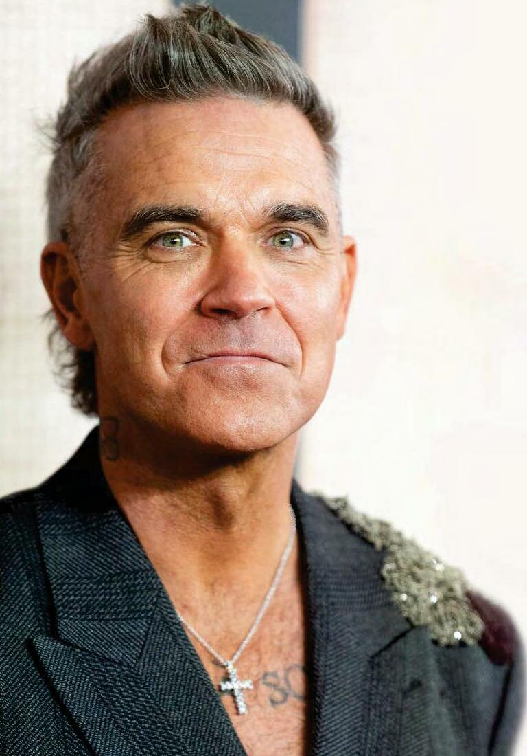 Robbie is hoping for duet with Dolly after his movie hit in US