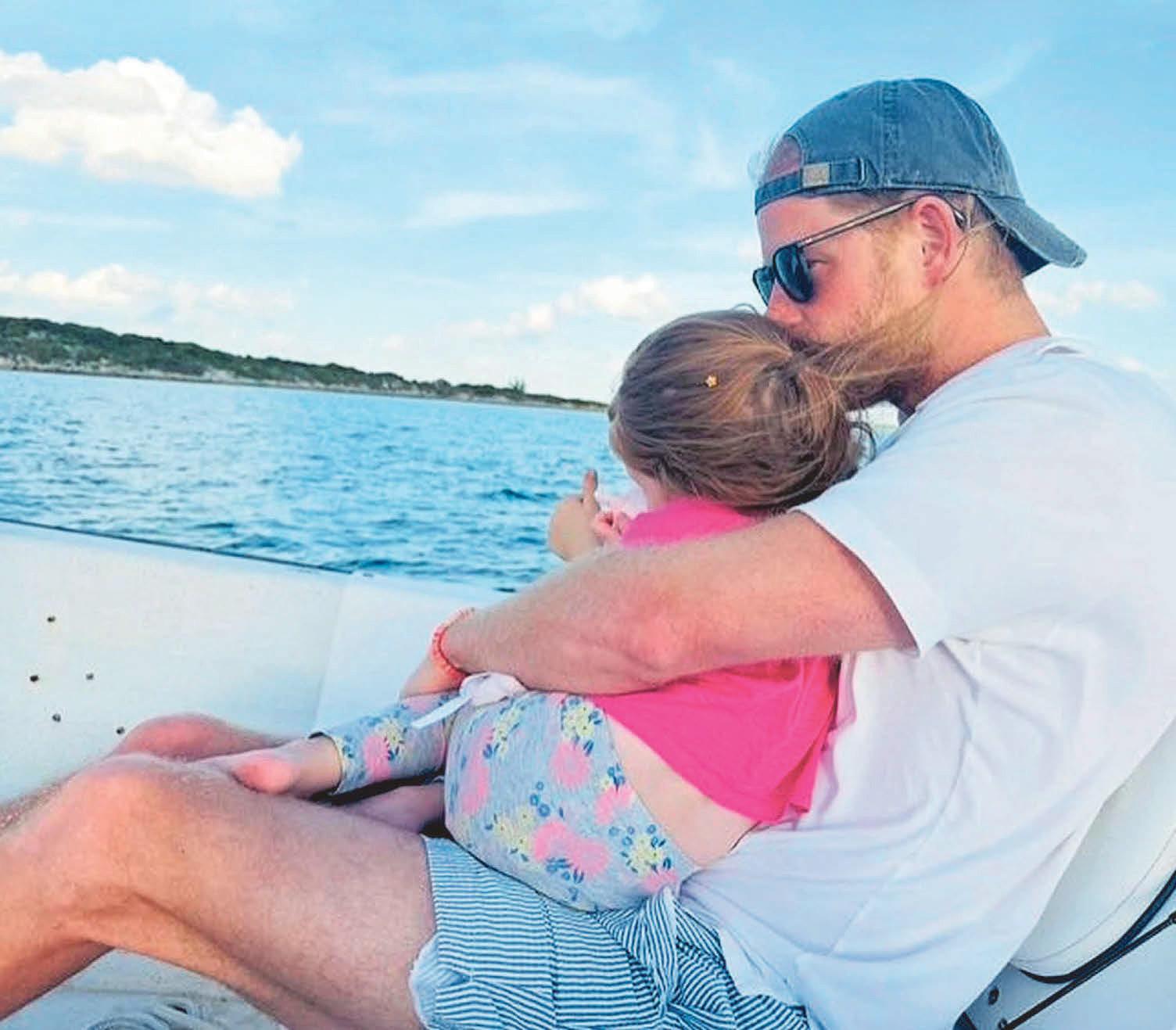 Doting dad Harry's sweet moment with his little princess