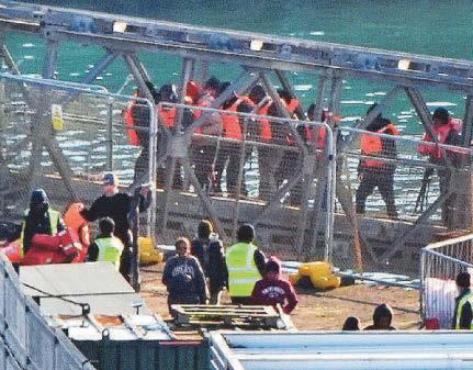 Hopefuls arrive on t calmer seas...ending a 28-day break in small boat crossings