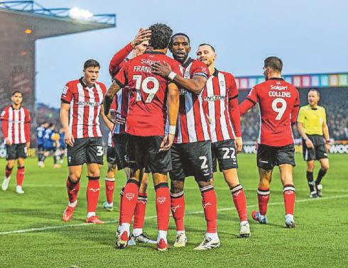 Lincoln move level with Stockport at top of League One