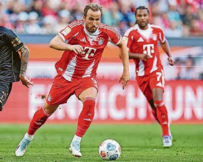 Kane supplies bullets to keep Bayern firing