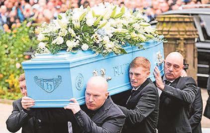 Grieving Claire says a tearful farewell as 'people's champ' is laid to rest