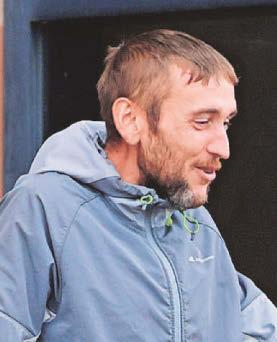 Thief stole from charity and spat at police officer