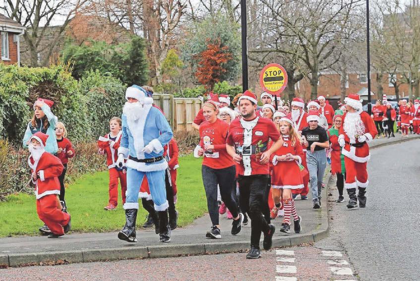 A sea of Santas and elves took to the pavement to raise £1,500 for charity