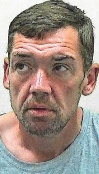 Bookies robber assaulted woman during raid