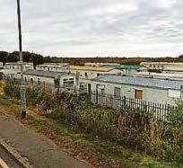 Two die after a blaze at a caravan park