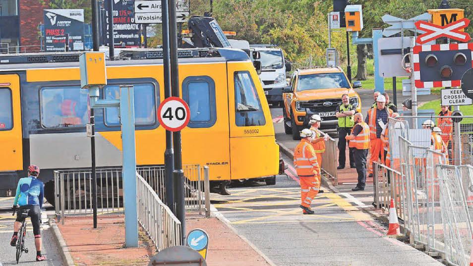 Metro hits car at level crossing
