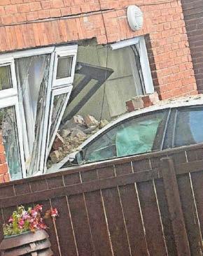 Man hospitalised as car hits house