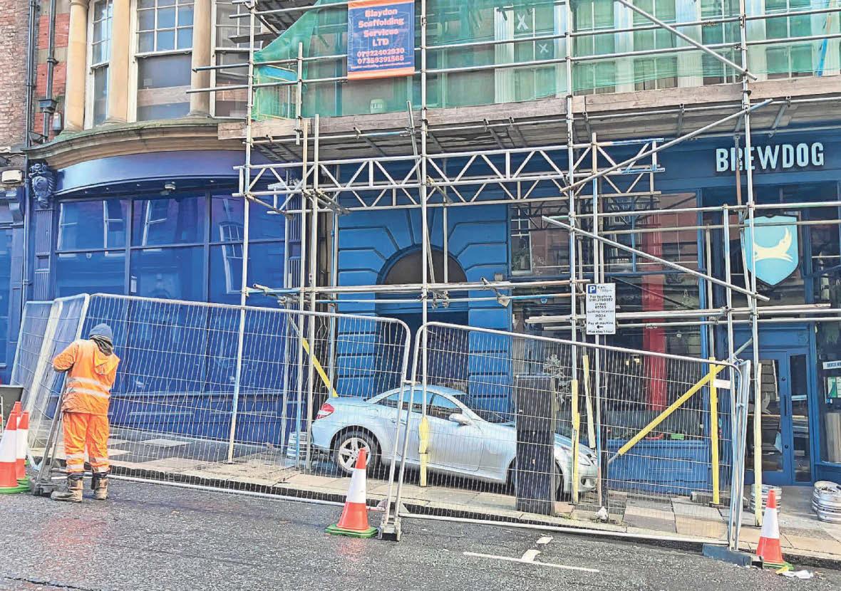 Rollaway car crashes and becomes lodged within scaffolding