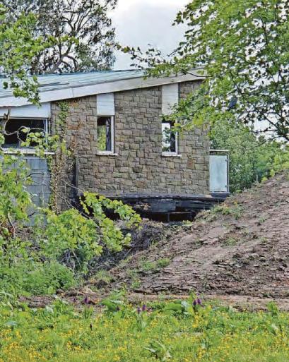 Probe into cause of blaze at large, empty house