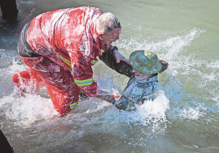 Winds blow raft race off course but fundraisers rise to challenge