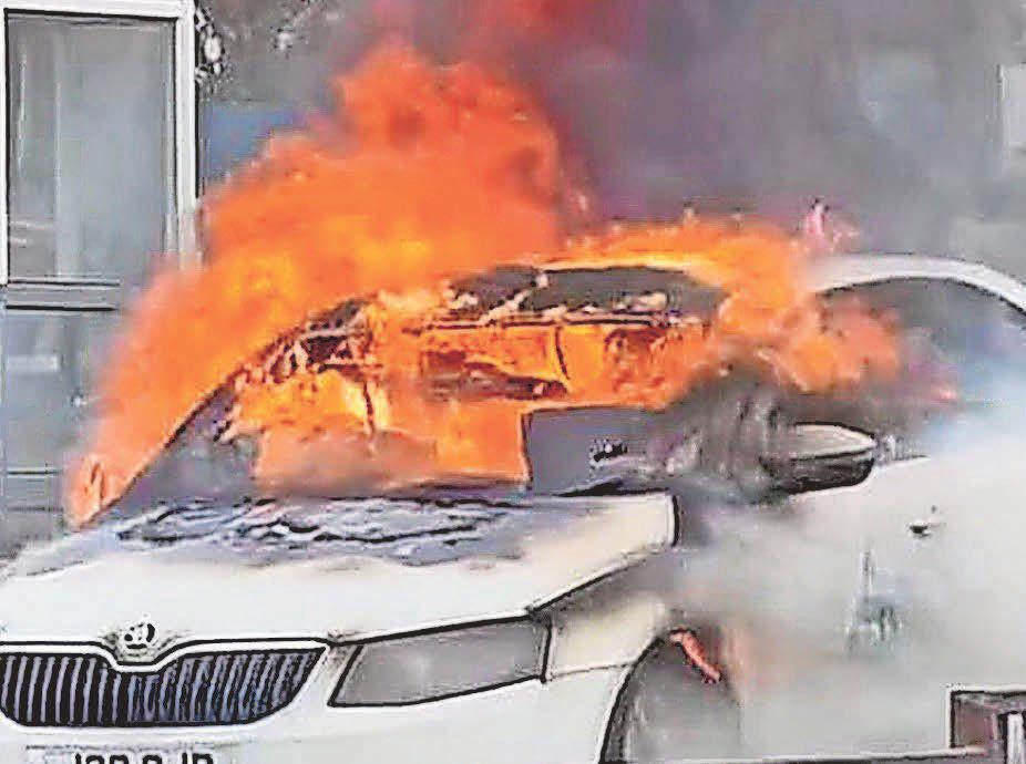 Taxi catches fire at traffic lights