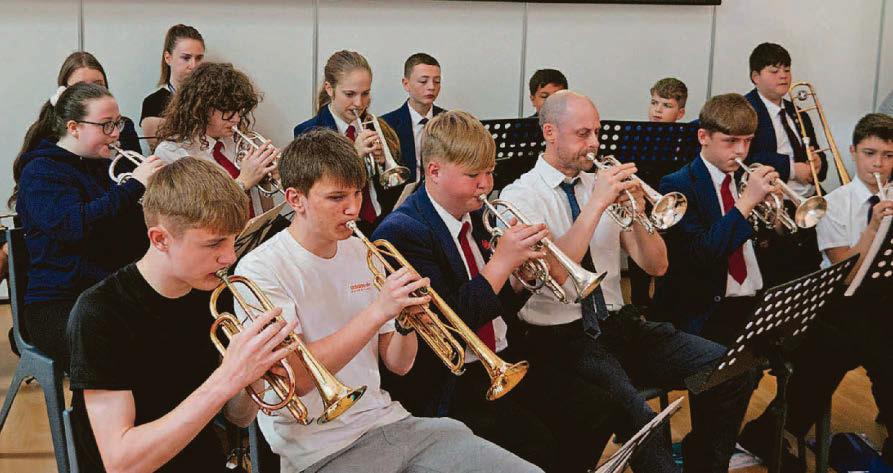 Students and staff tune in to create band harmony