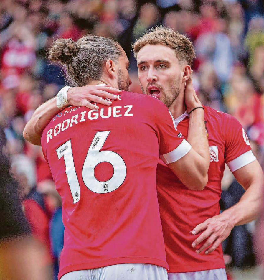 PARKINSON'S PRIDE SHINES THROUGH AS DRAGONS ROAR TO PROMOTION