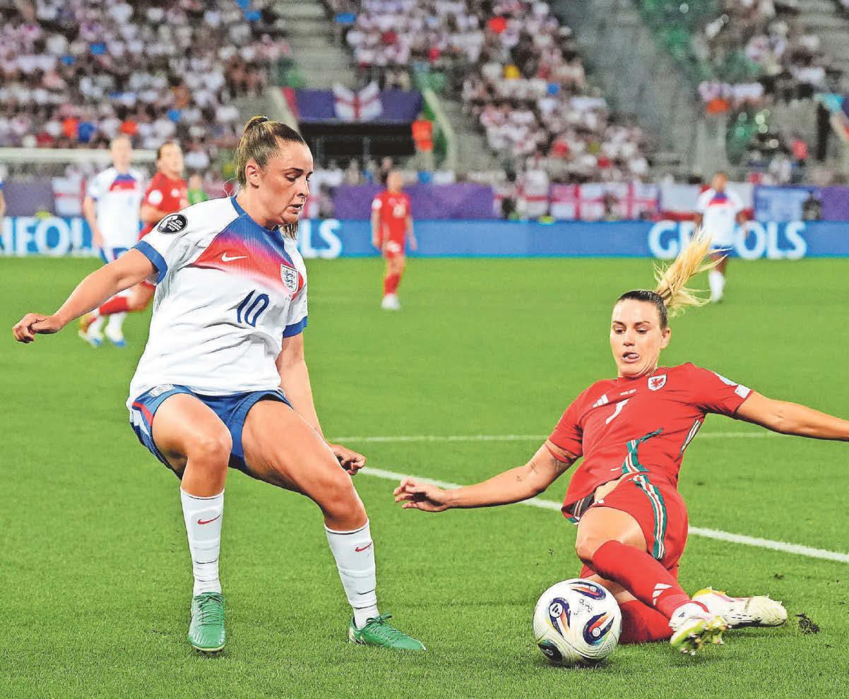 WALES SUFFER EXIT AS CHAMPS ROAR ON