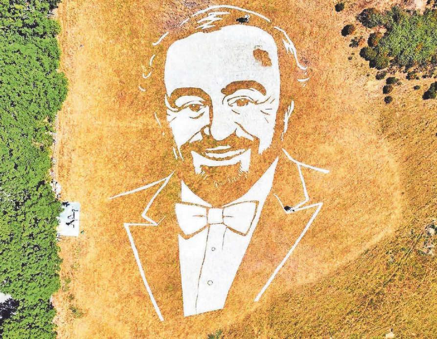 Pavarotti stars again as 150ft mural of tenor appears on hillside